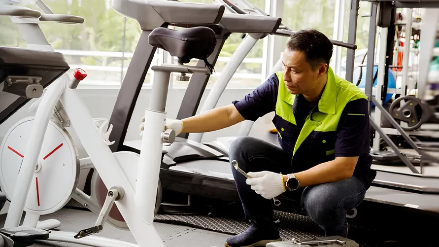 How often should gym owners service and replace gym equipment